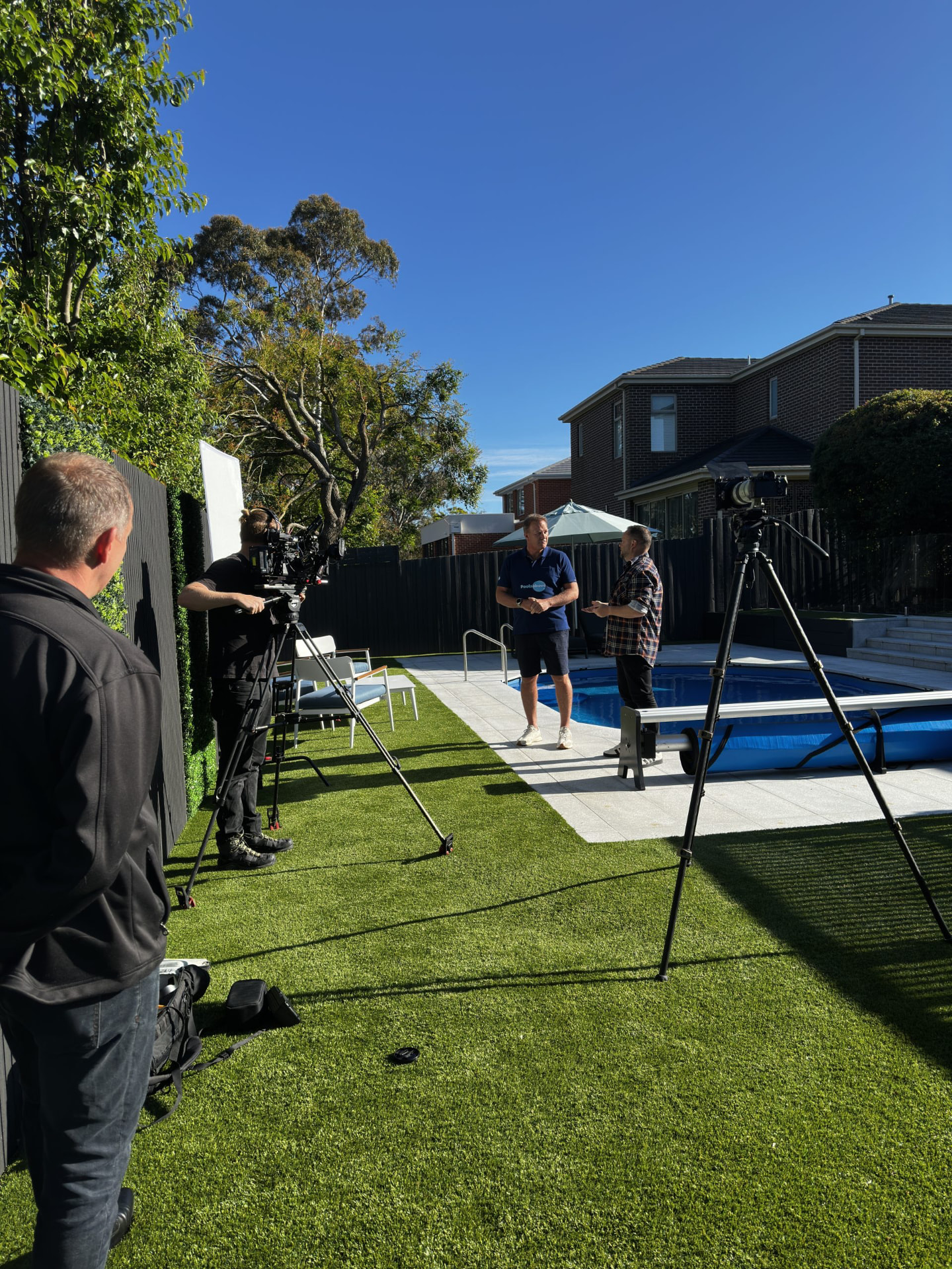 Poolsabove filming a pool feature at a completed Melbourne backyard pool