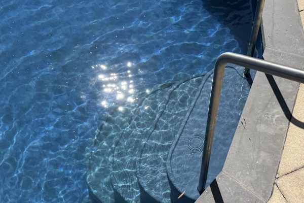 Poolsabove internal seatsteps fitted in a pool